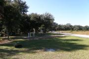 Partially shaded campsite 22 is near the overflow parking area and the horse paddocks. Deer and turkey are evident in this area.