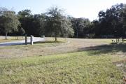 Photo: 2, ROSS PRAIRIE. View of campsite wtih water and electric hookups. A picnic table and fire ring can be seen.