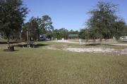 Photo: 2, ROSS PRAIRIE. View of campsite wtih water and electric hookups. A picnic table and fire ring can be seen.
