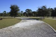 Photo: 7, ROSS PRAIRIE.View of campsite with electric hookups. A picnic table and fire ring can be seen.