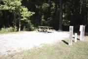 Photo: 001, SANTOS CAMPGROUND. View of campsite with water and electric hookups and picnic table with fire ring.