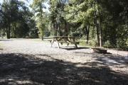 Photo: 001, SANTOS CAMPGROUND. View of campsite with water and electric hookups and picnic table with fire ring.