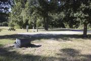 Photo: 002, SANTOS CAMPGROUND. View of campsite with water and electric hookups and picnic table with fire ring.