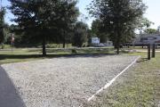 Photo: 002, SANTOS CAMPGROUND. View of campsite with water and electric hookups and picnic table with fire ring.