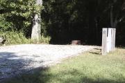 Photo: 003, SANTOS CAMPGROUND. View of campsite with water and electric hookups and picnic table with fire ring.
