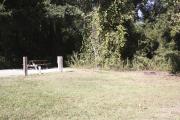 Photo: 006, SANTOS CAMPGROUND. View of campsite with water and electric hookups and picnic table with fire ring.