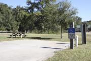 Photo: 009, SANTOS CAMPGROUND. ADA accessible site with concrete pad, electric and water hookups and picnic table.