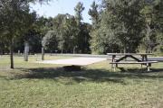 Photo: 009, SANTOS CAMPGROUND. View of ADA accessible site with concrete pad and picnic table.