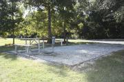 Photo: 013, SANTOS CAMPGROUND. View of campsite with water and electric hookups and picnic table with fire ring.