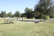 Photo: 019, SANTOS CAMPGROUND. View of campsite with water and electric hookups and picnic table with fire ring.