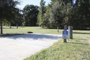 Photo: 020, SANTOS CAMPGROUND. ADA accessible site with concrete pad, electric and water hookups and fire ring.